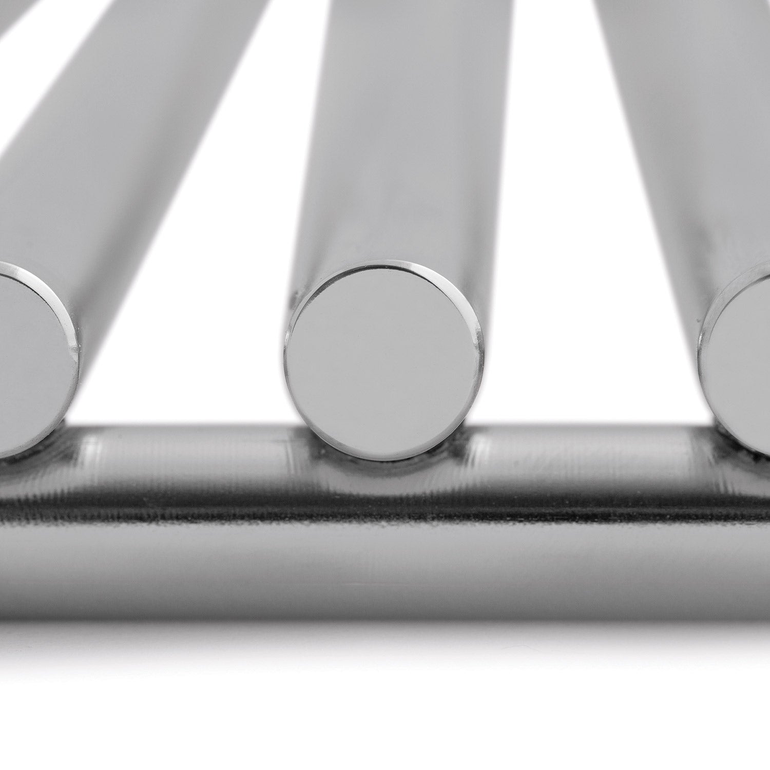 Stainless steel gas grill burner tubes with round control knobs close-up