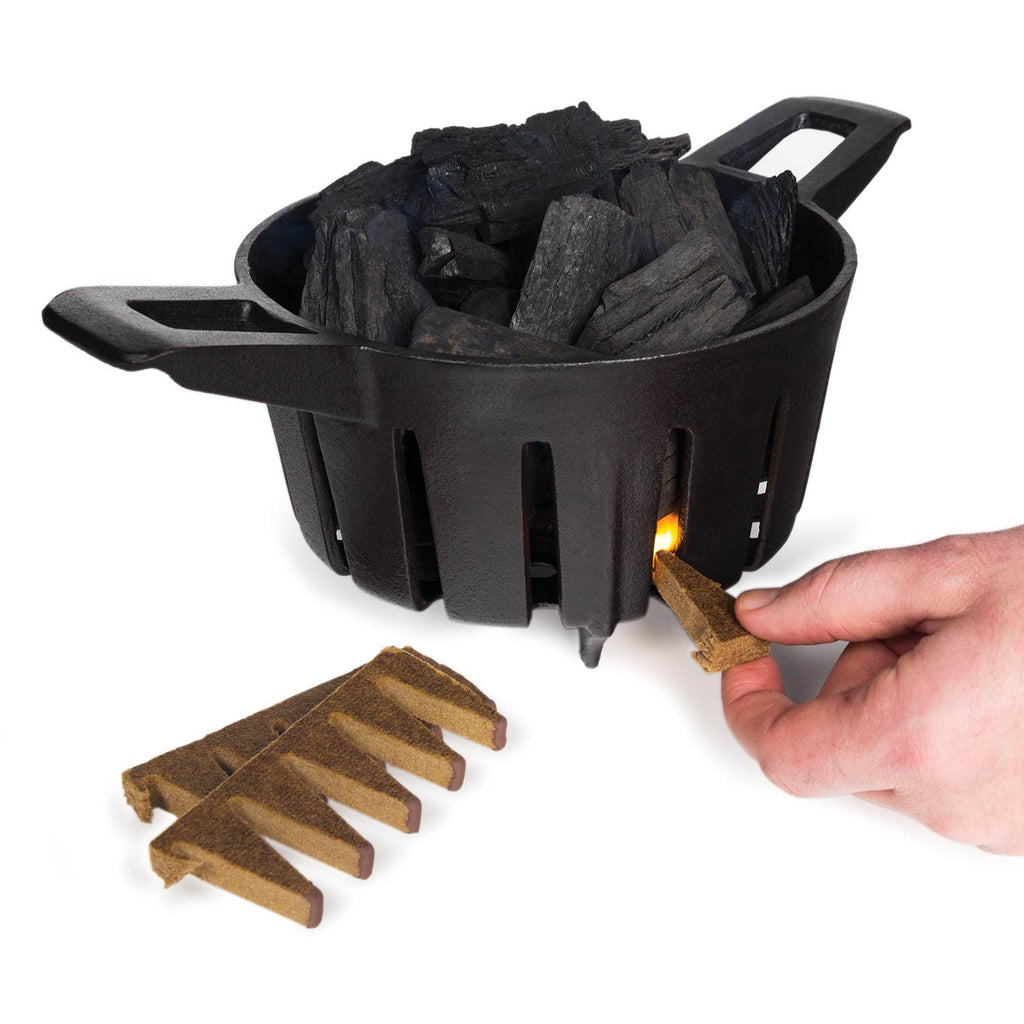 Black grill fire starter cup with blocks and a lit starter piece