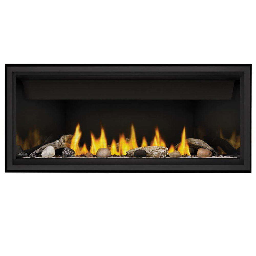 Black linear direct-vent fireplace with glowing flames and river rock burner bed