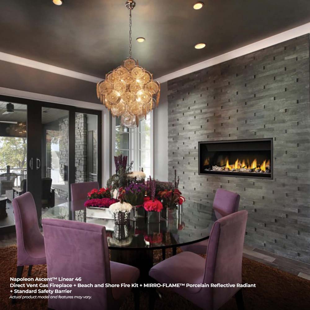Linear fireplace in gray brick surround with flames, set into a wall niche