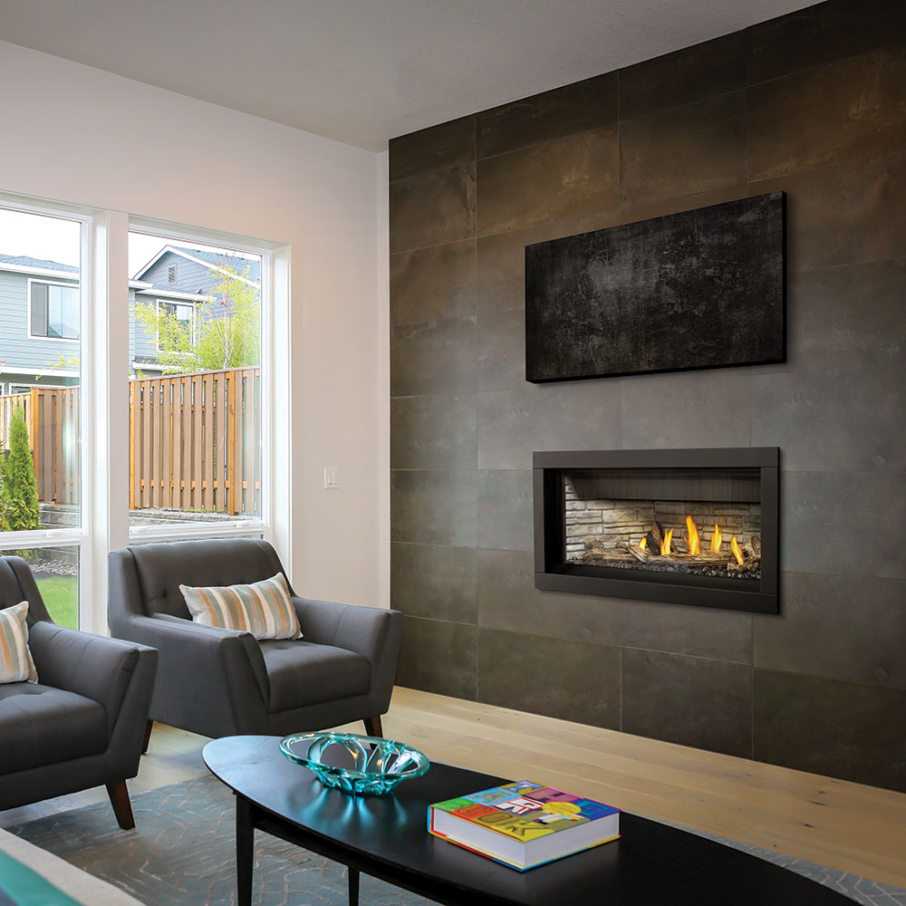 Built-in linear gas fireplace with burning logs in a black frame, set into a wall