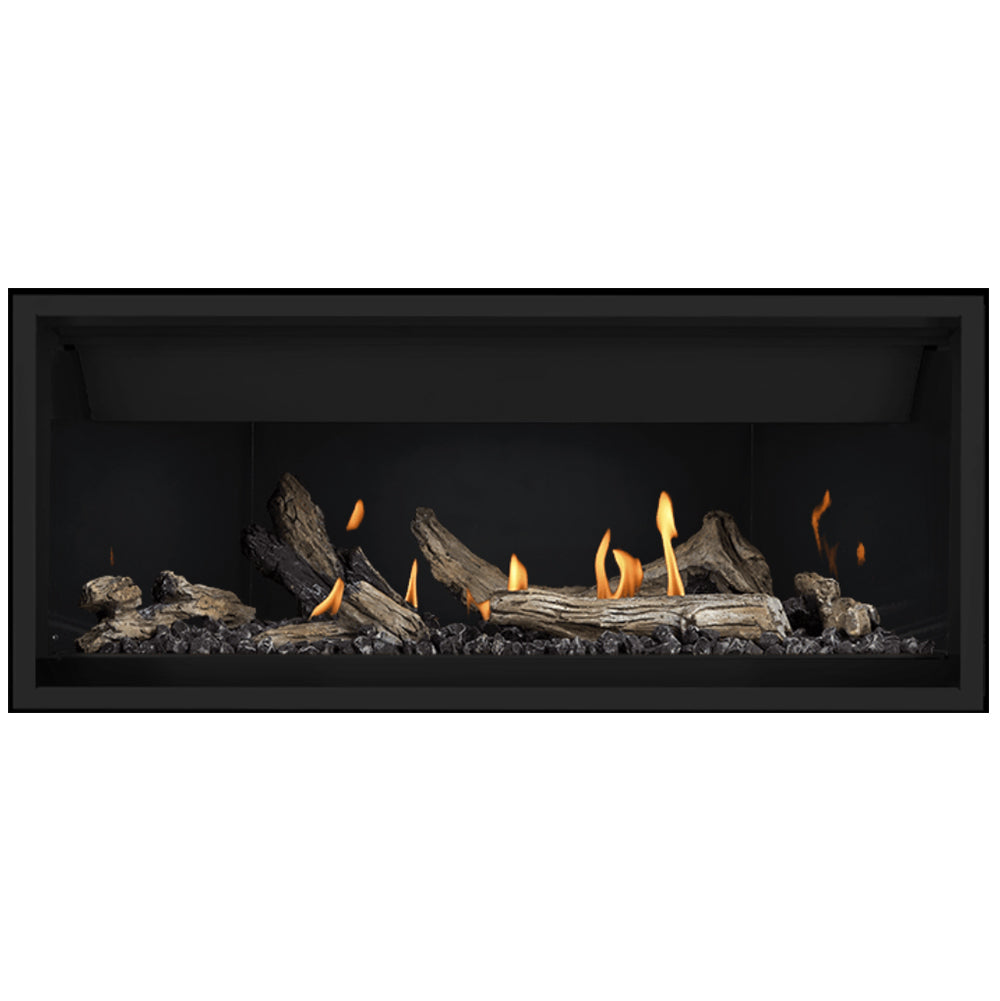 Linear gas fireplace with burning logs and scattered flames in a black firebox