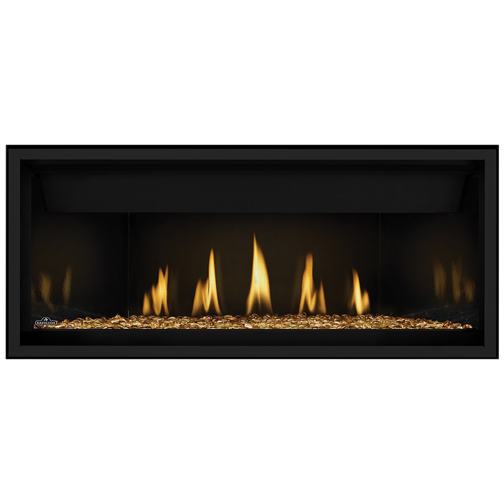 Direct vent gas fireplace with gold glass embers and black surround; flames visible