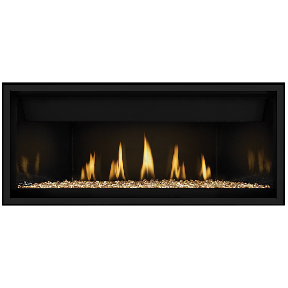 Direct vent gas fireplace with tan glass embers and black surround; flames visible