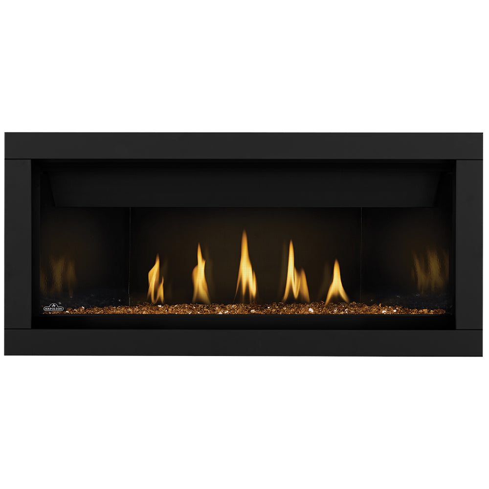 Linear gas fireplace with glowing ember bed and orange flames behind black surround