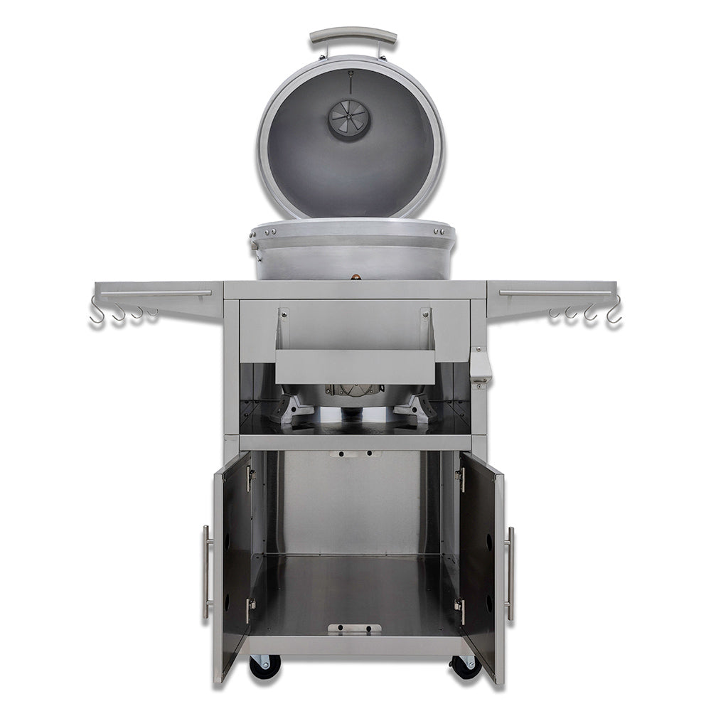 Kamado grill on cart with lid open showing firebox and interior shelves