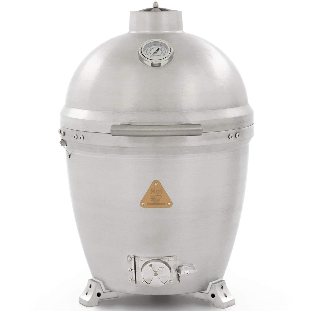 Cast aluminum kamado grill with closed silver dome lid and thermometer gauge