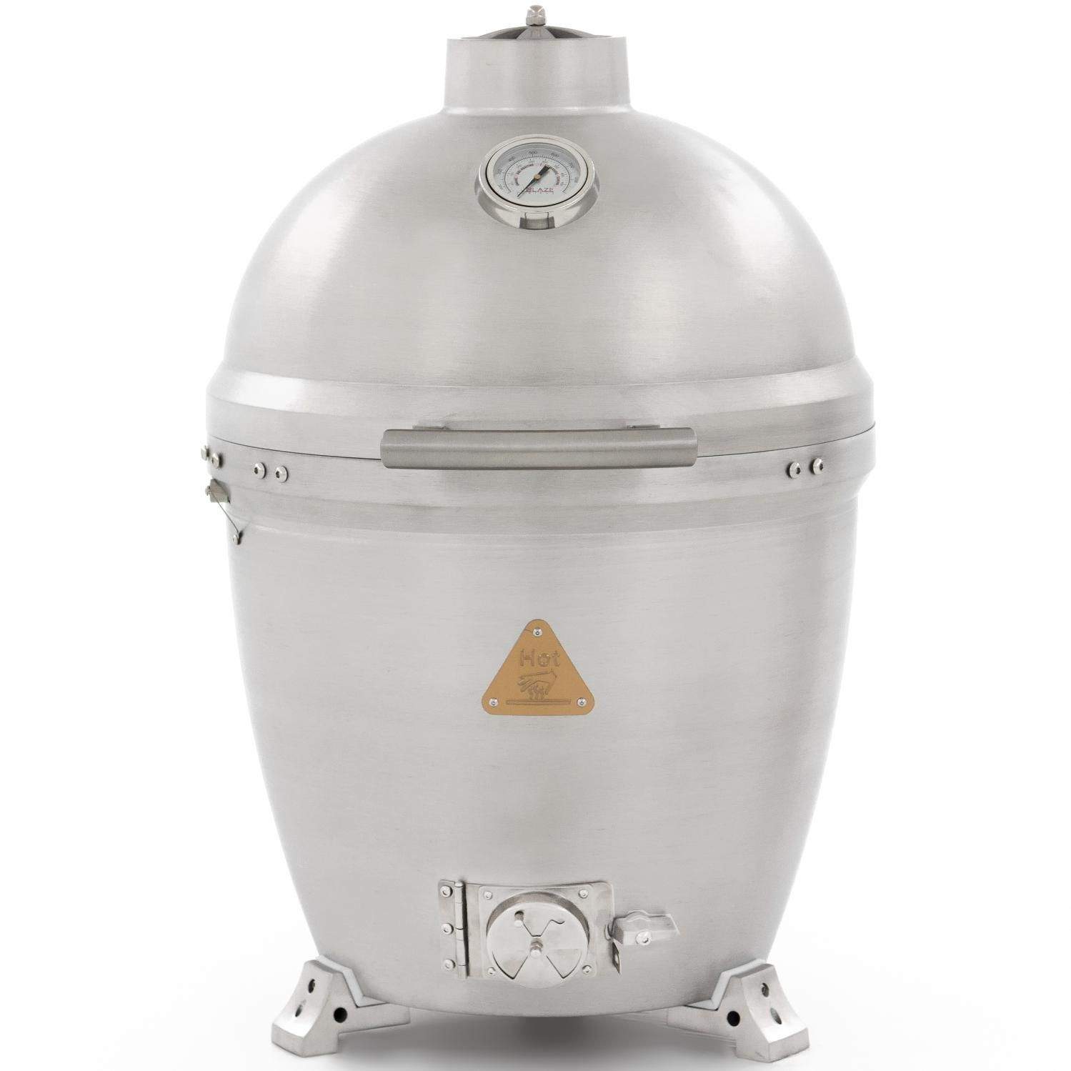 Cast aluminum kamado grill with closed silver dome lid and thermometer gauge
