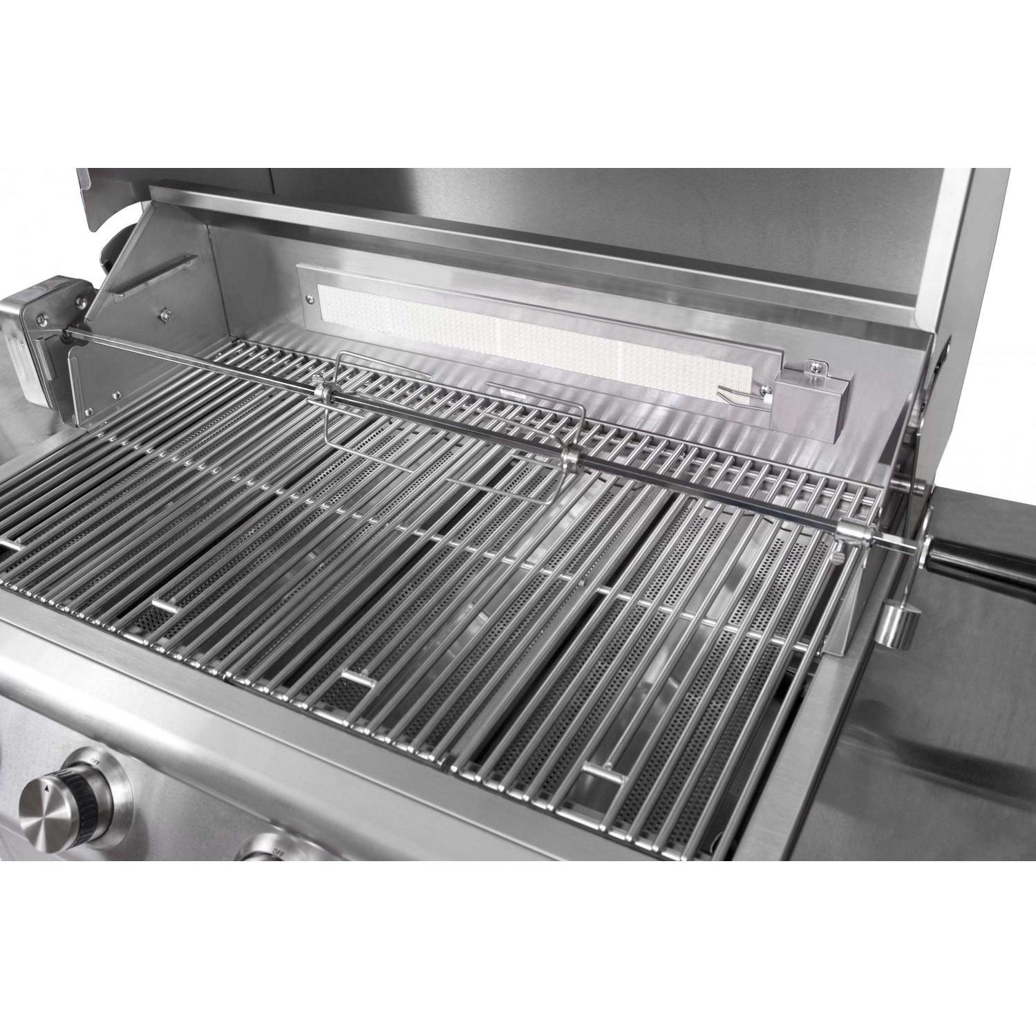 Rotisserie insert with metal skewers on grill racks inside a stainless grill