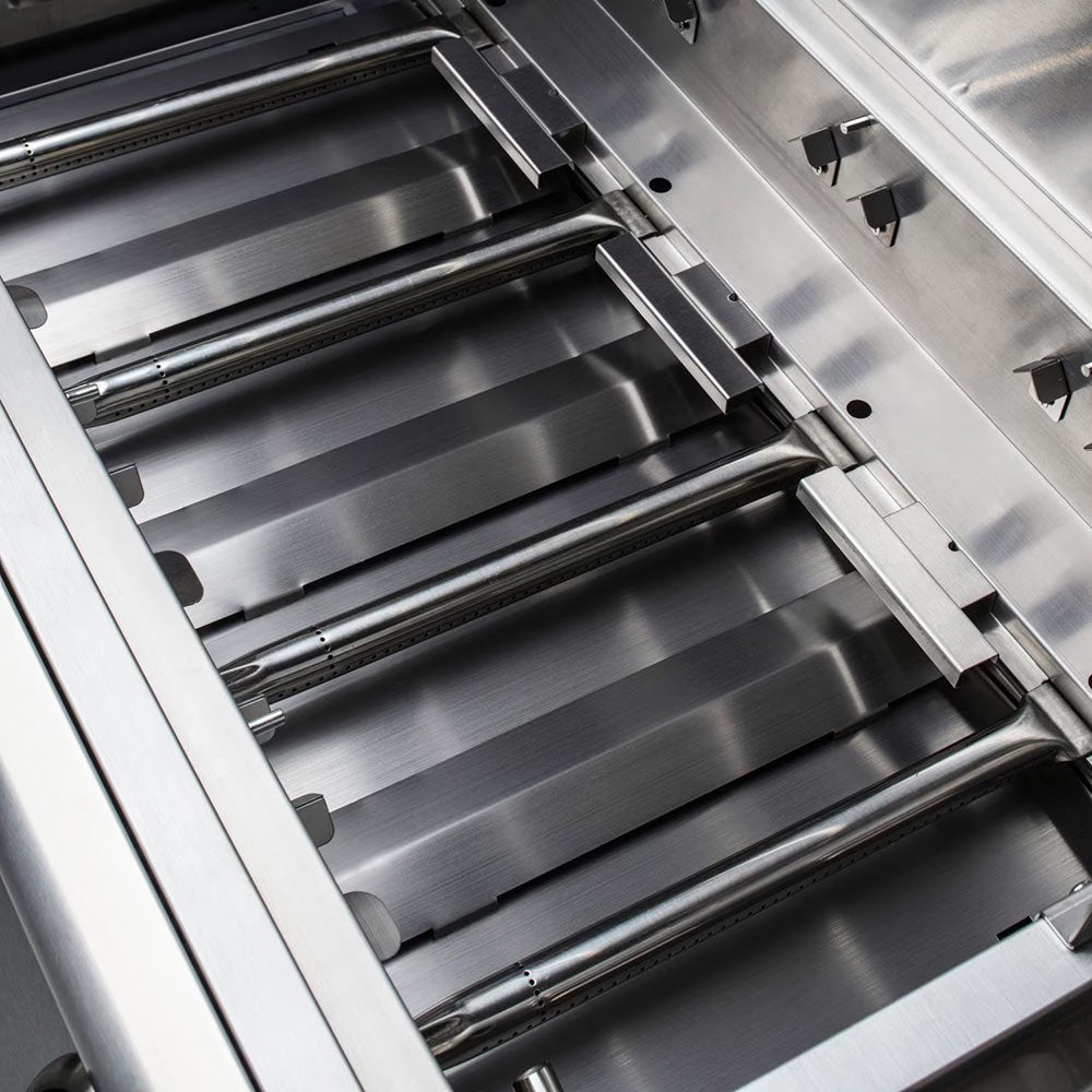 Gas grill cooking area with stainless grates and angled burner bars