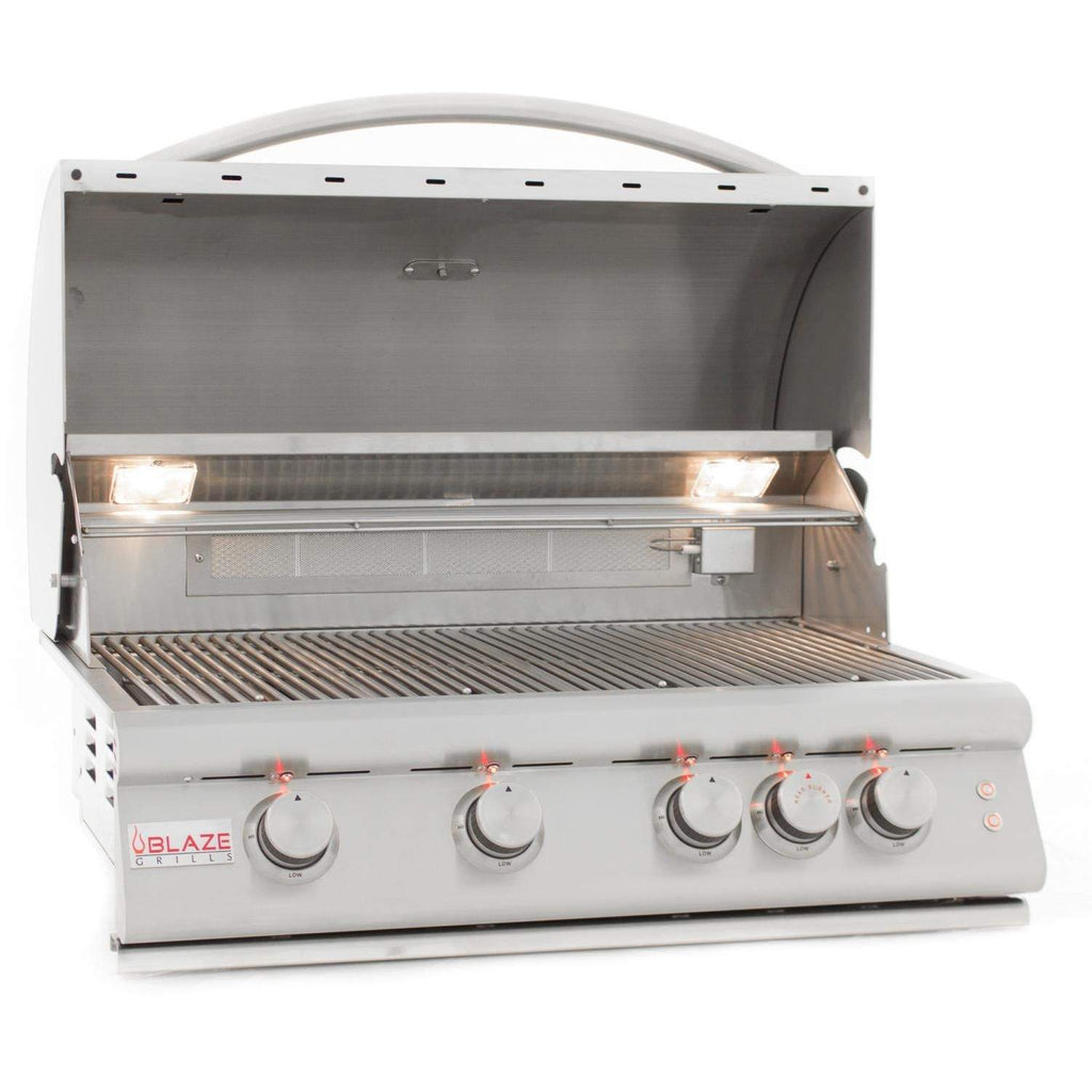 Built-in gas grill open lid with internal light and burner area