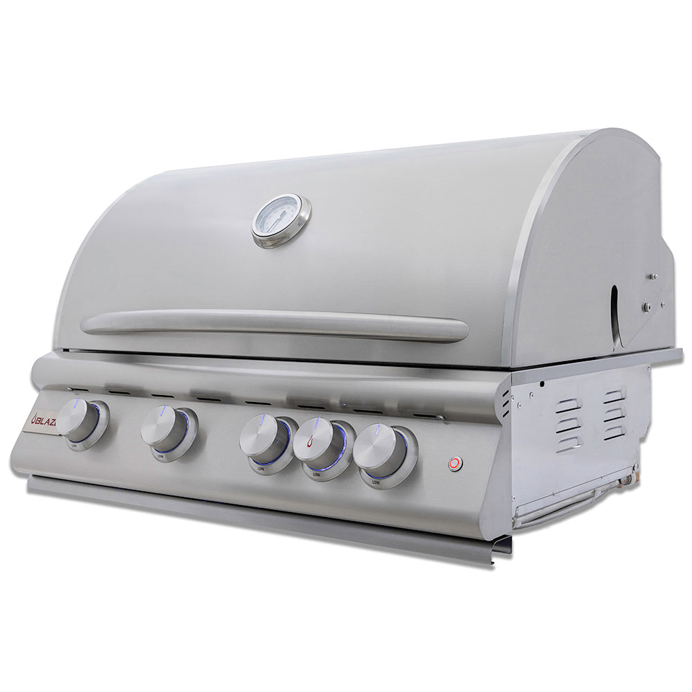 Built-in gas grill with rounded lid and front control knobs on side angle