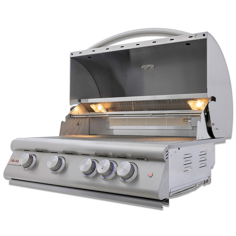 Built-in gas grill with open lid and glowing burners behind the grill grate