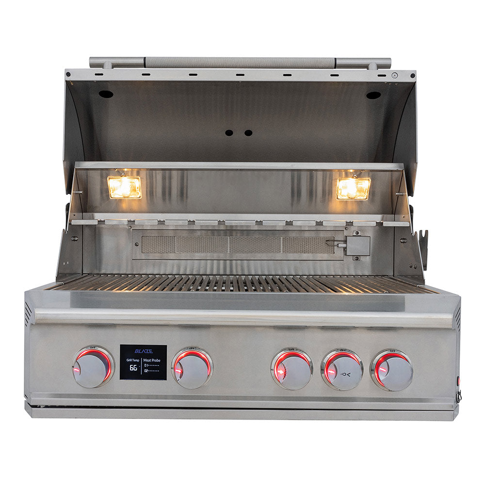 Built-in 4-burner gas grill with open hood, grates, and illuminated burners