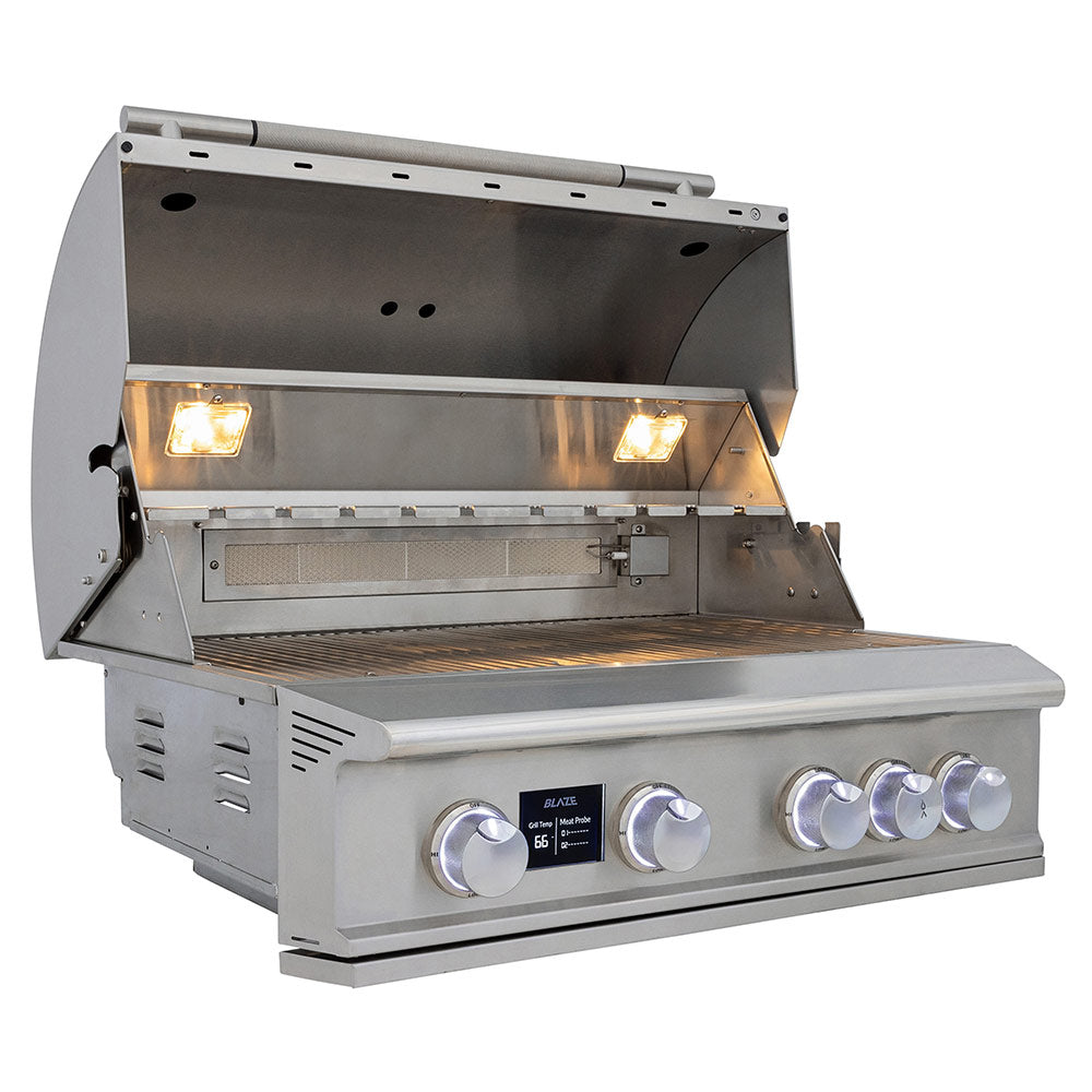 Open stainless steel Blaze gas grill showing cooking grates and illuminated burners