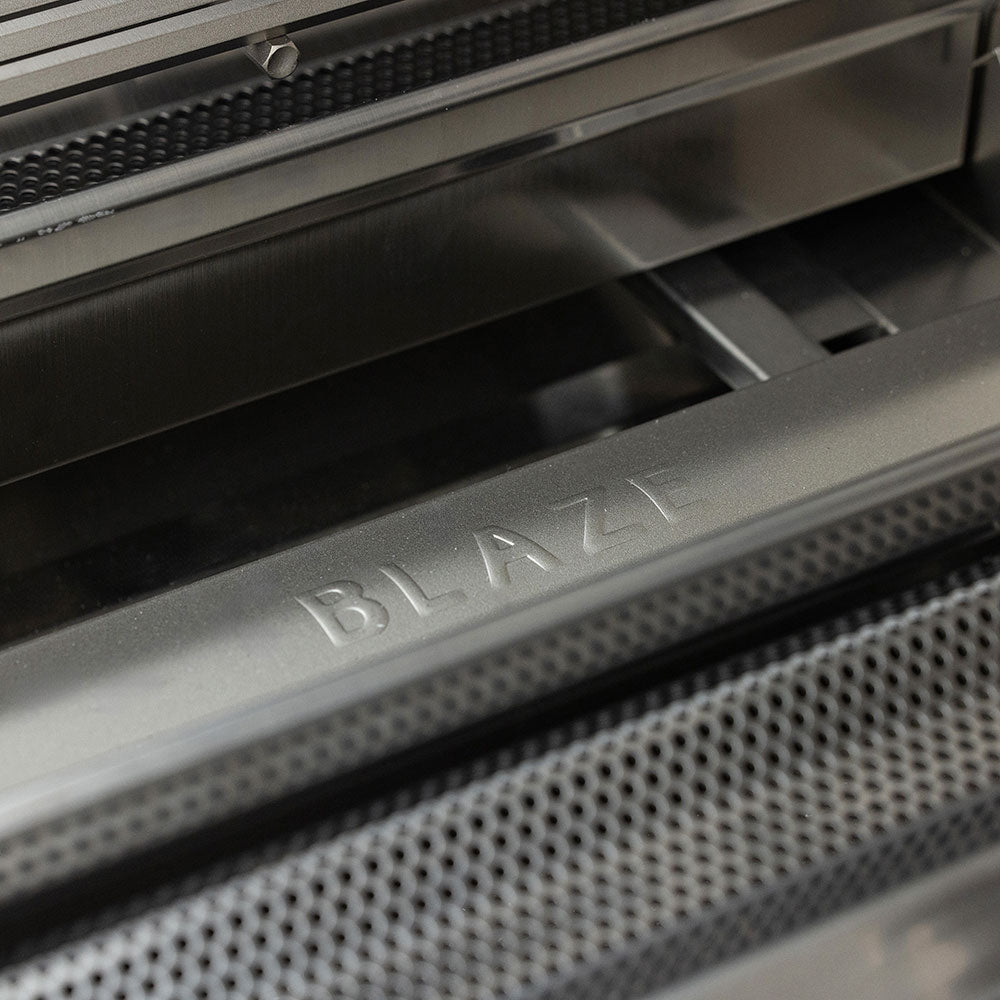 Stainless steel burner housing with Blaze branding