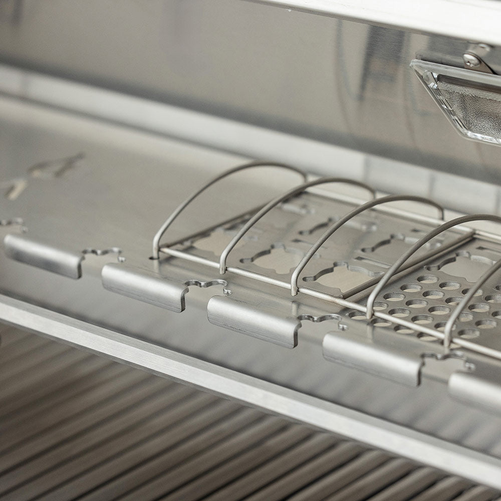 Stainless steel grill warming rack above the burner area