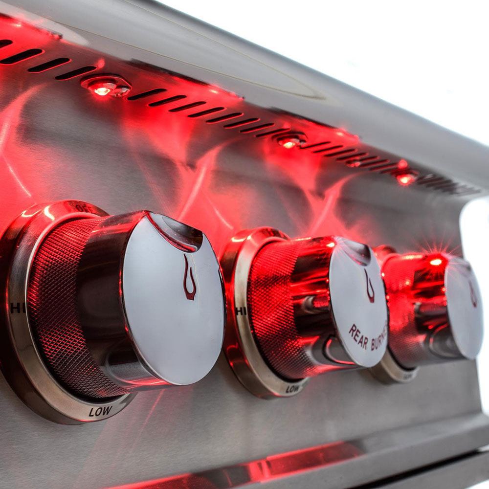 Stainless gas grill control knobs with red flame indicator lights on the control panel
