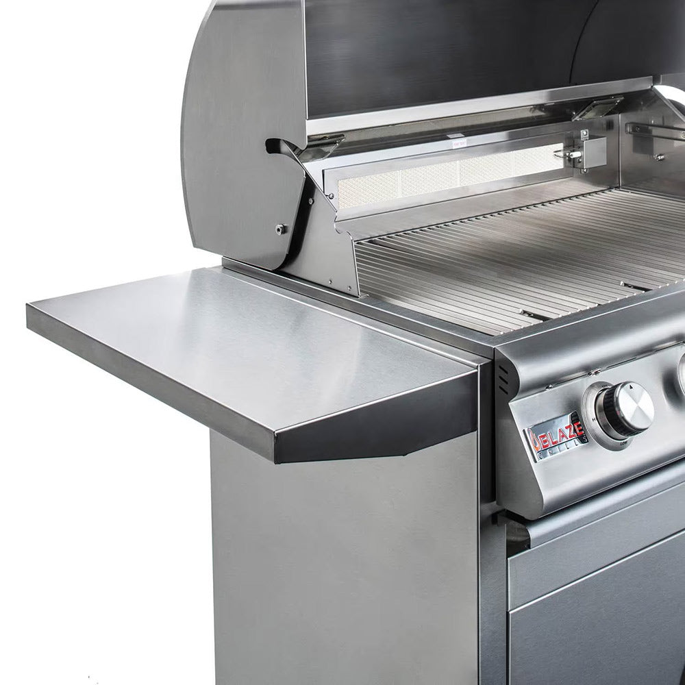 Open stainless steel gas grill with grill grate and control knob on the right