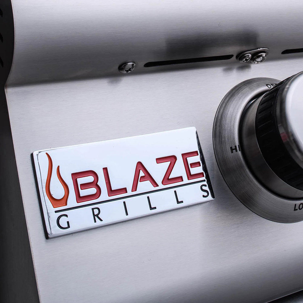 Stainless gas grill control panel with Blaze Grills logo and temperature control knob