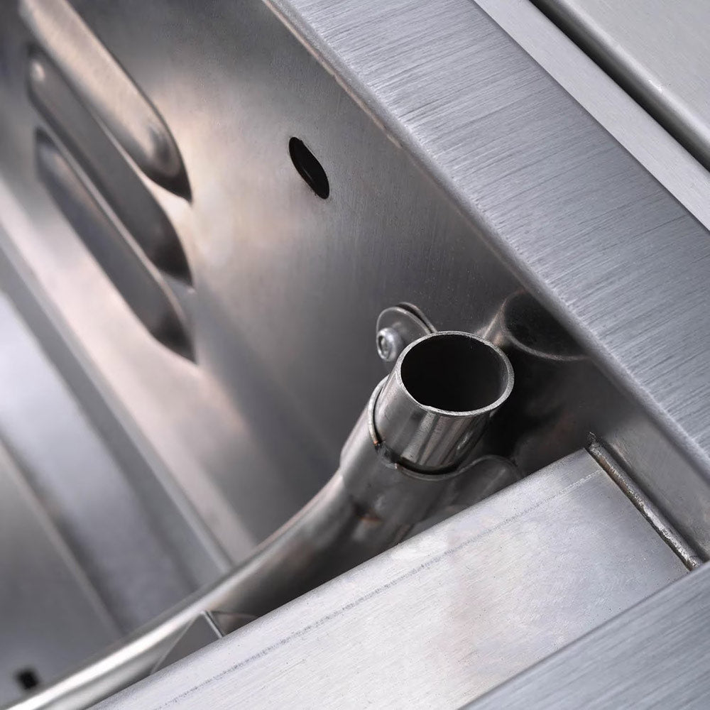 Gas grill interior vent outlet detail with stainless fittings inside the firebox