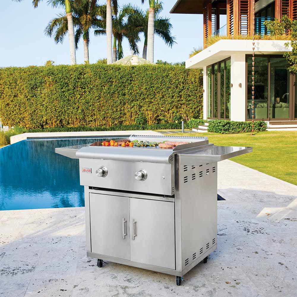 Stainless steel freestanding gas griddle with side shelves and two front control knobs