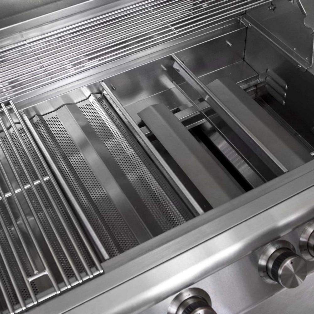 Gas grill interior with stainless cooking grates and rows of burner tubes