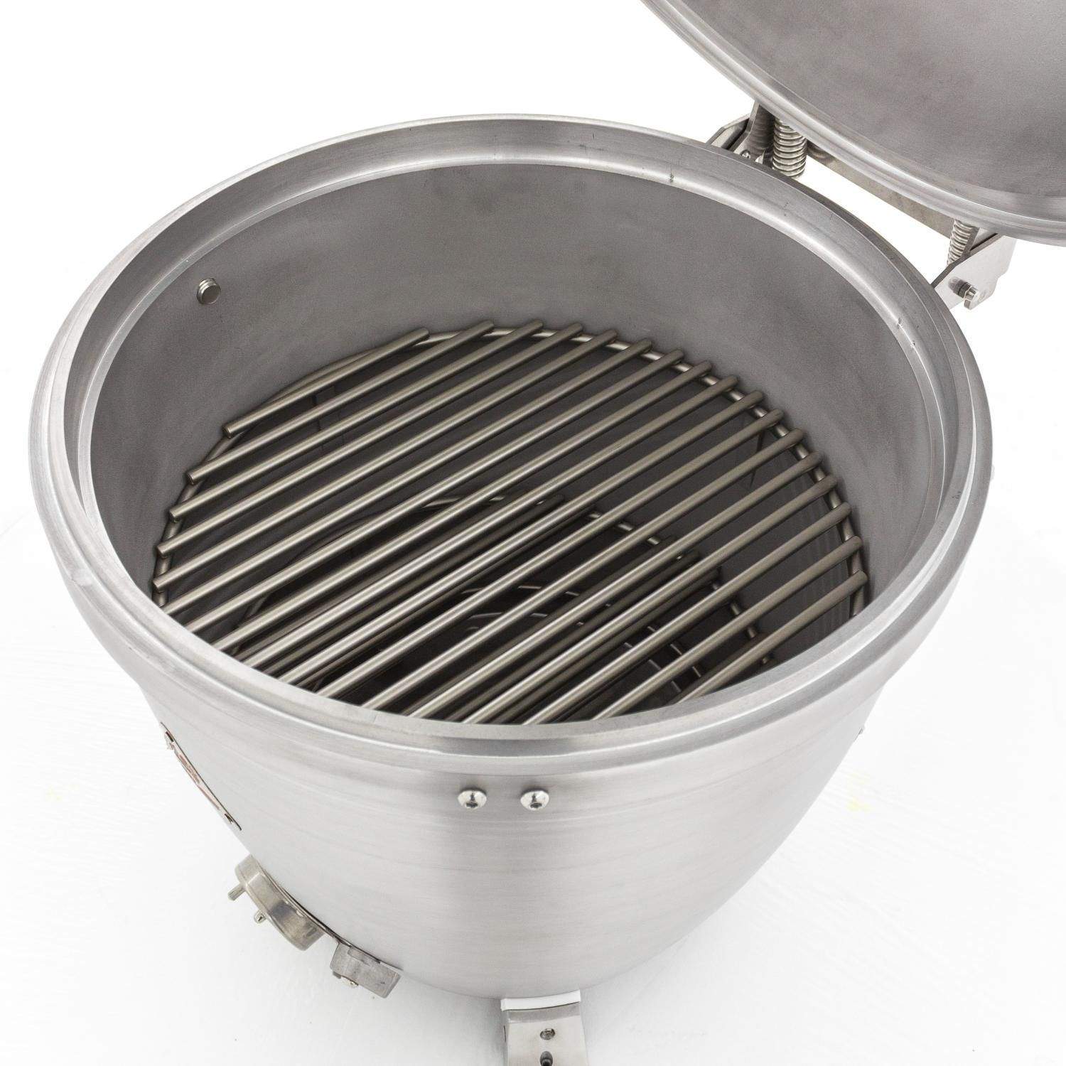Cast aluminum kamado grill interior with cooking grate and front control knobs