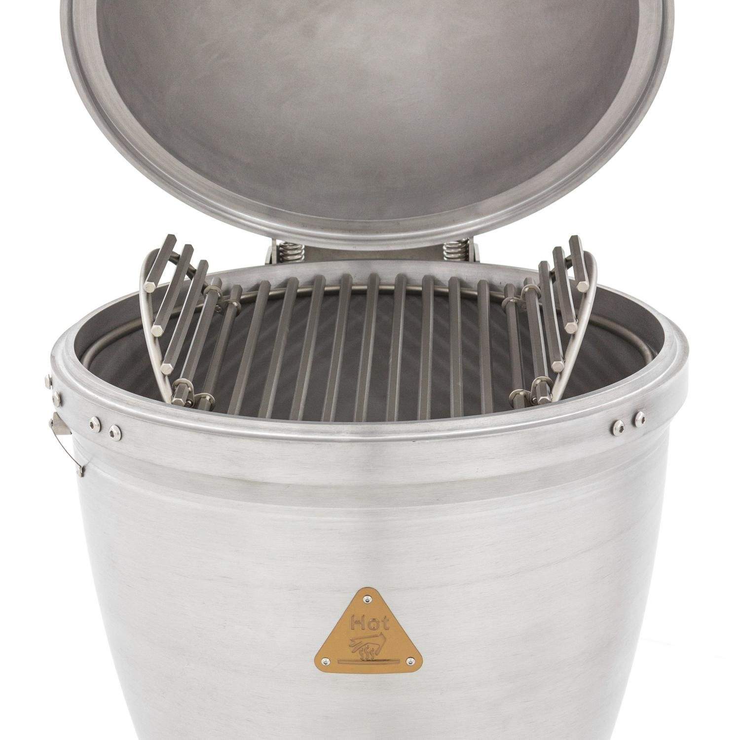 Cast aluminum kamado grill open with cooking grate and raised heat deflector