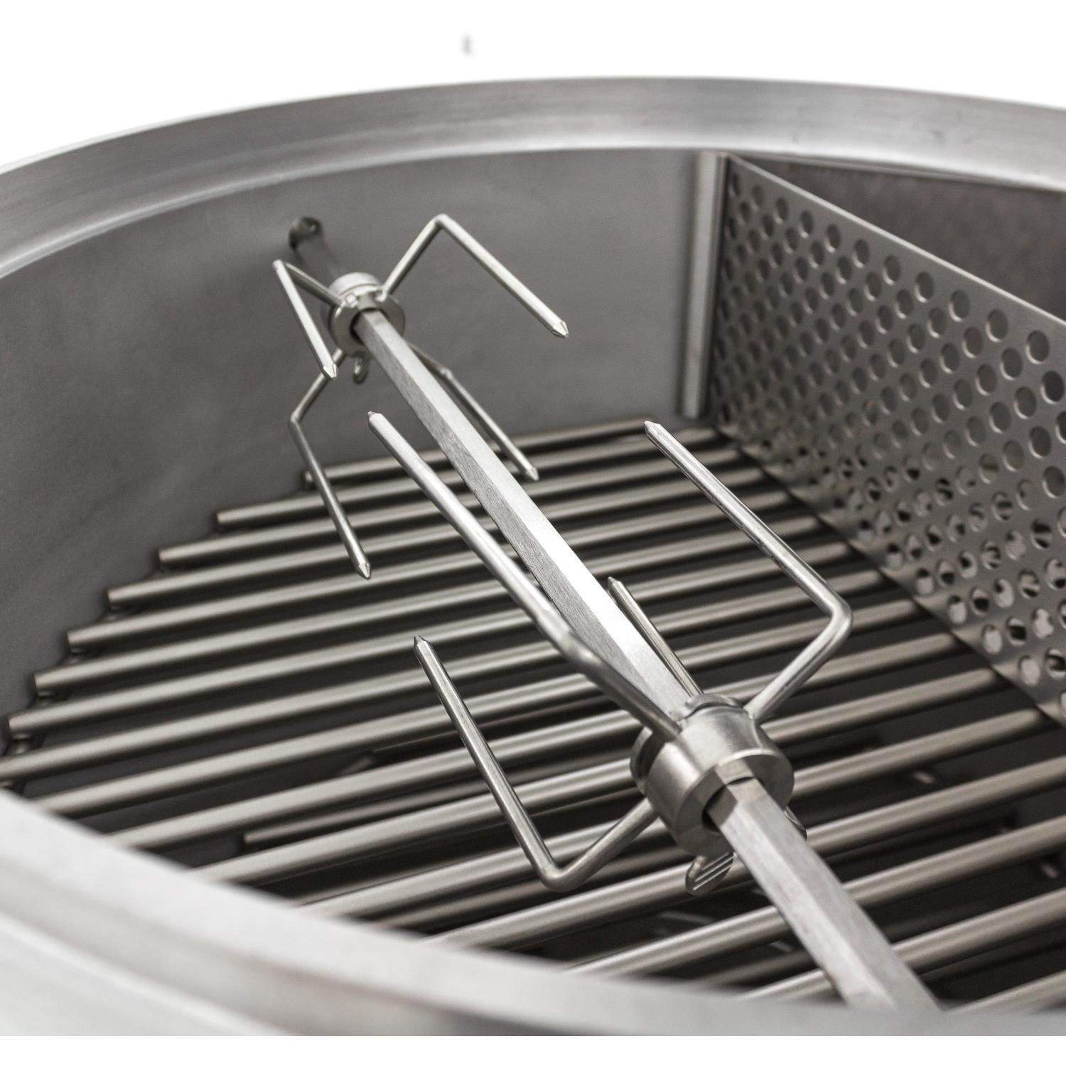 Rotisserie forks and crossbar spit rod over metal grill grate inside cook chamber