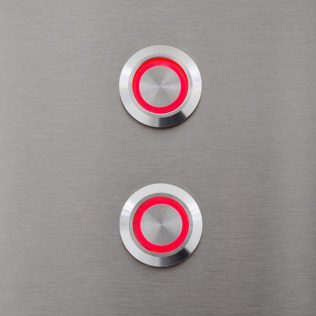 Gas grill control buttons with red circular indicators on brushed stainless panel