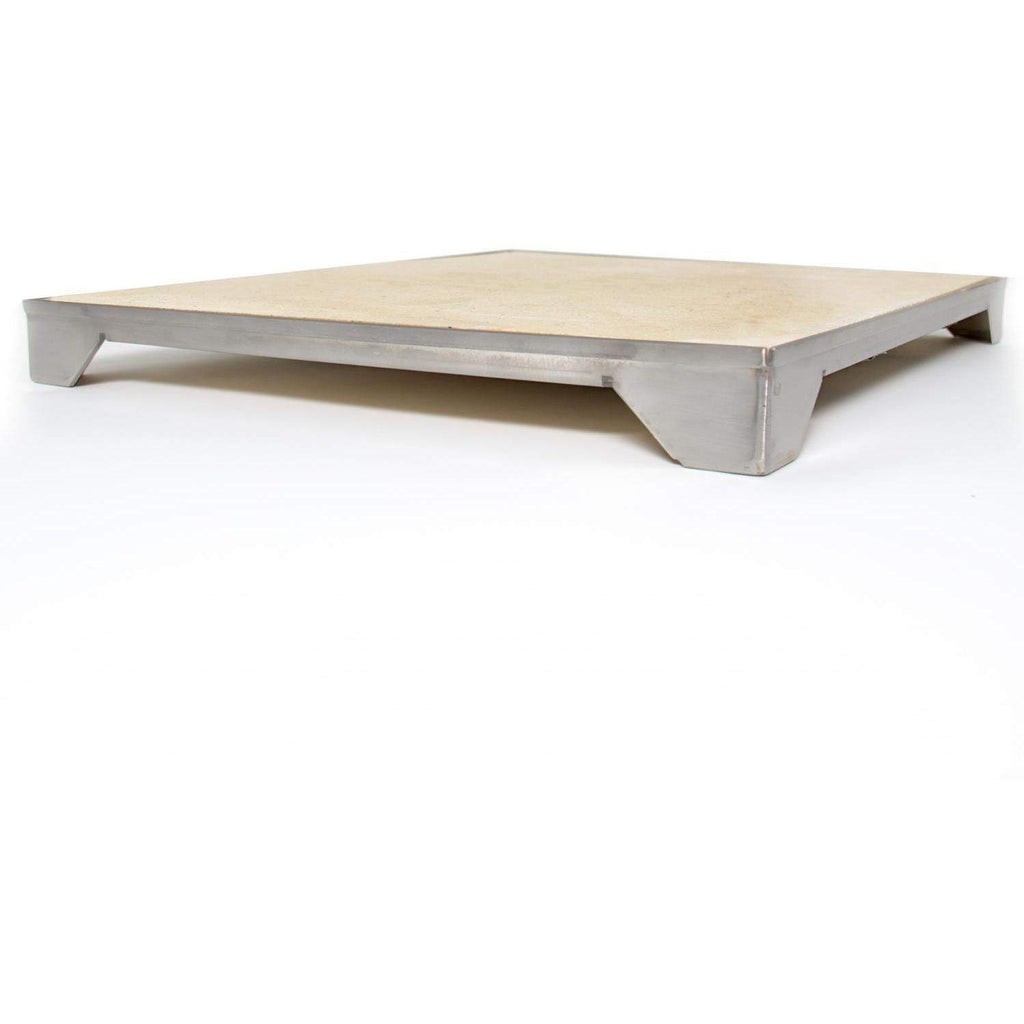 Ceramic pizza stone with gray metal supports, pale tan top surface.