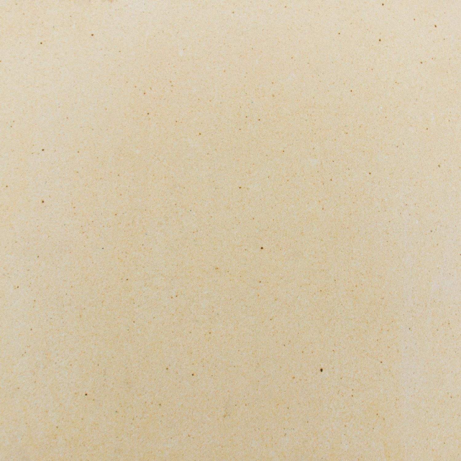 Light tan ceramic pizza stone surface with fine speckled texture