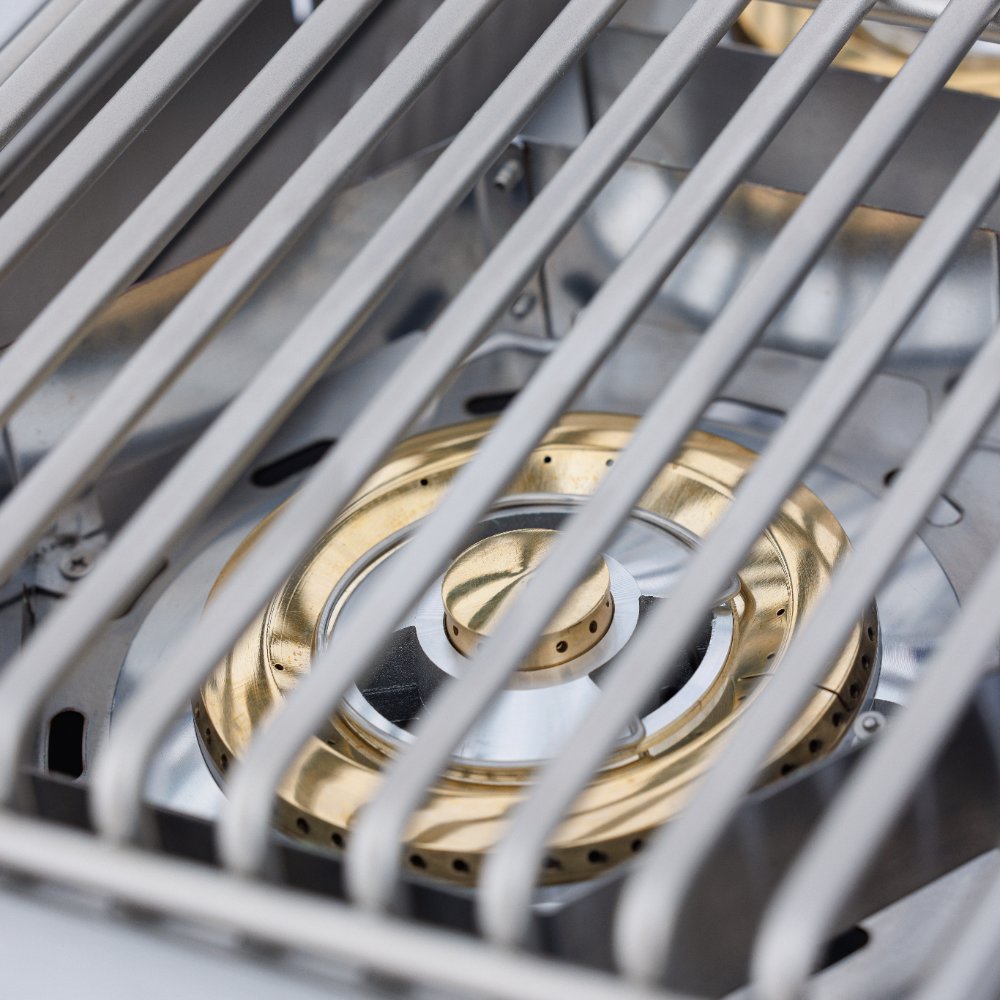 Double side burner grate with visible burner rings inside the stainless steel housing