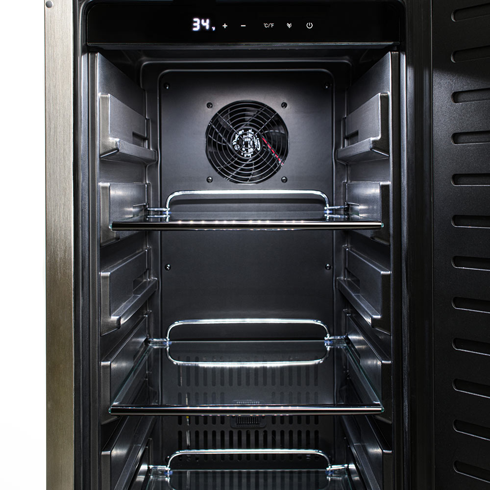 Outdoor-rated refrigerator interior view, fan at top and three wire shelves