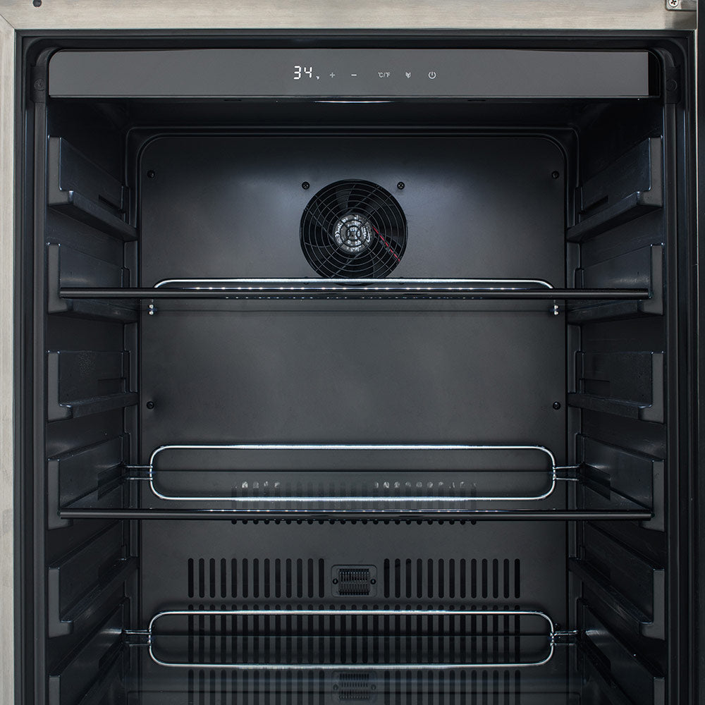 Refrigerator interior with fan grille, wire shelves, and storage baskets