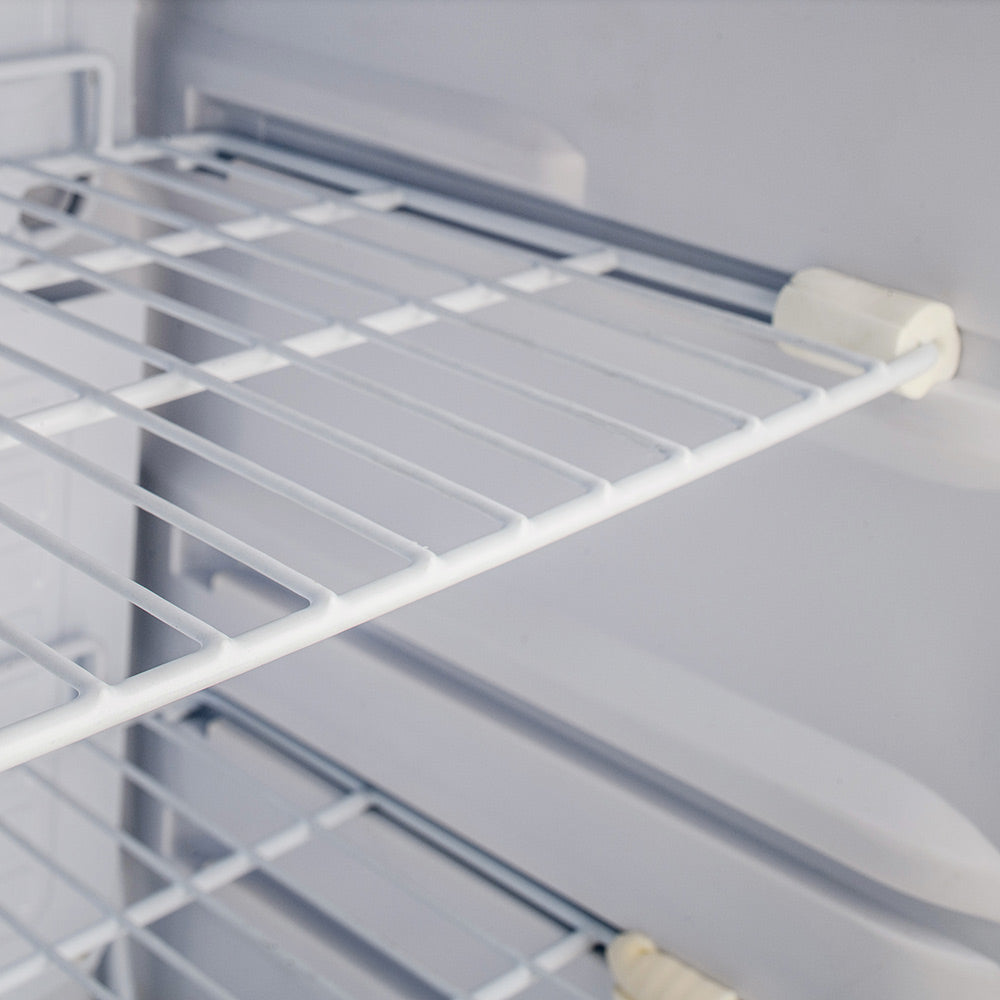 Refrigerator wire shelf with side support rails in white interior