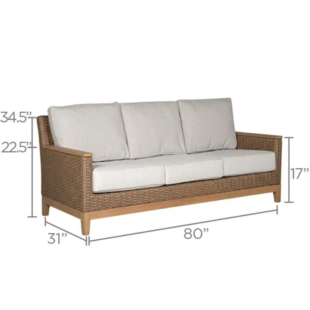 Outdoor loveseat with white cushions and brown woven frame with slatted wood arms