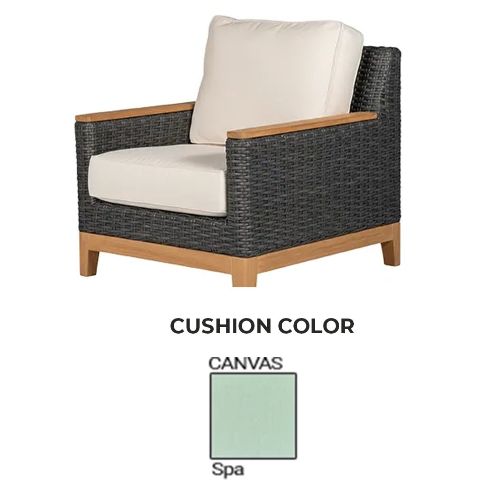 Charcoal wicker club chair with cream cushion and light wood armrests
