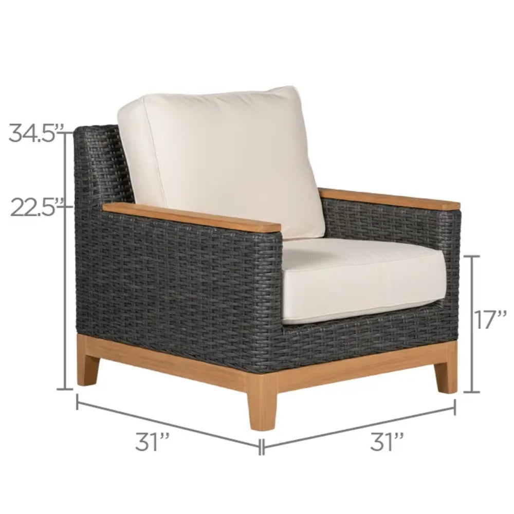 Outdoor club chair with dark woven frame, light cream cushion, and teak-style base
