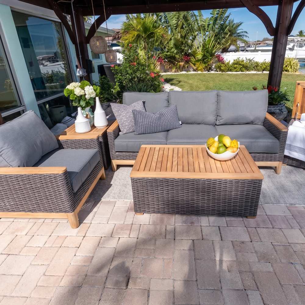 Dark woven wicker outdoor coffee table with rectangular wood top