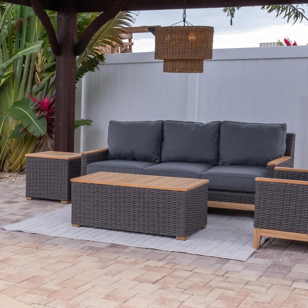 Gray woven wicker outdoor coffee table with rectangular wood top