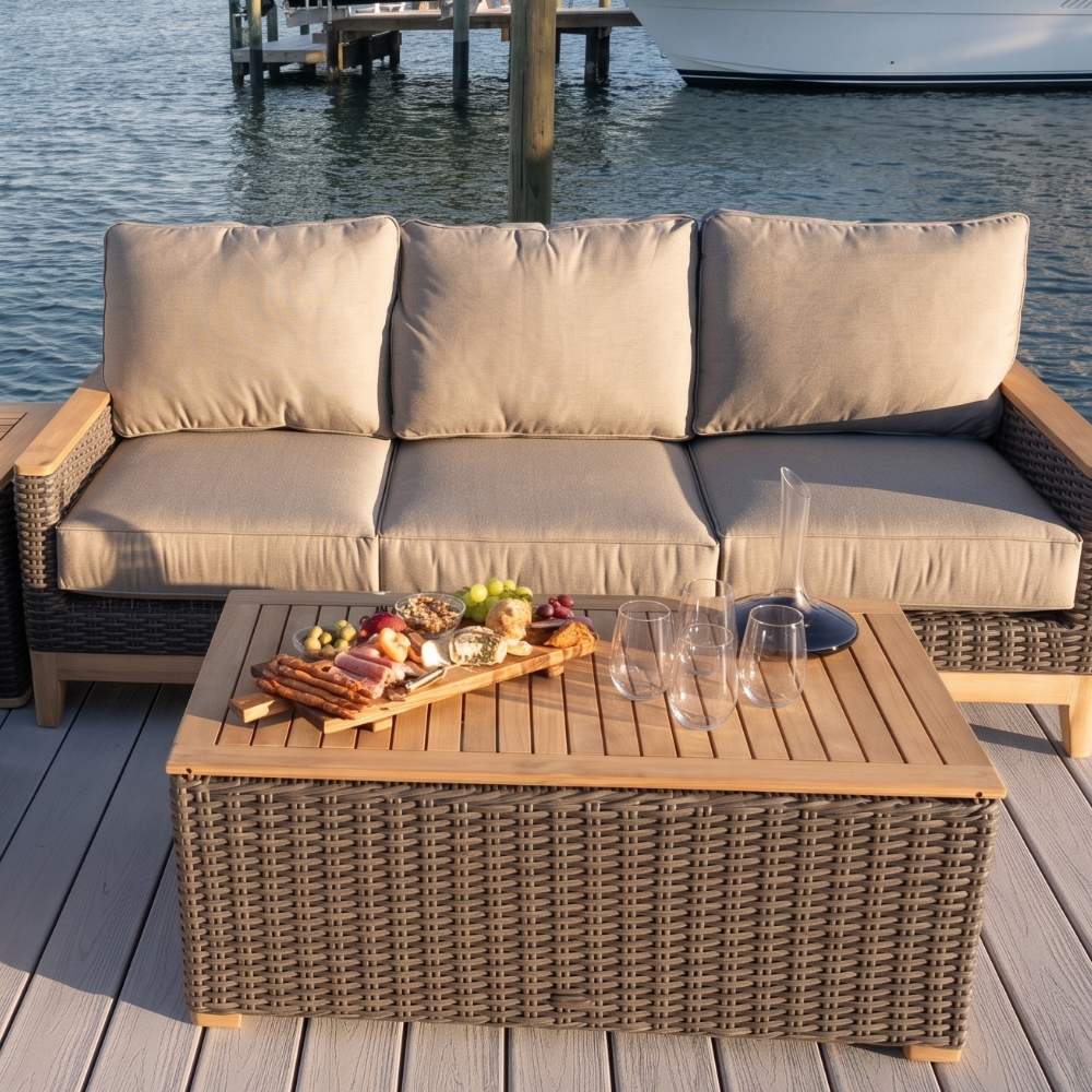 Light woven wicker outdoor coffee table with rectangular wood top and open weave sides