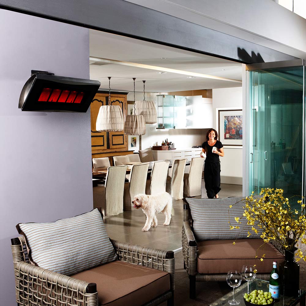 Radiant gas heater mounted overhead with red glowing burner display