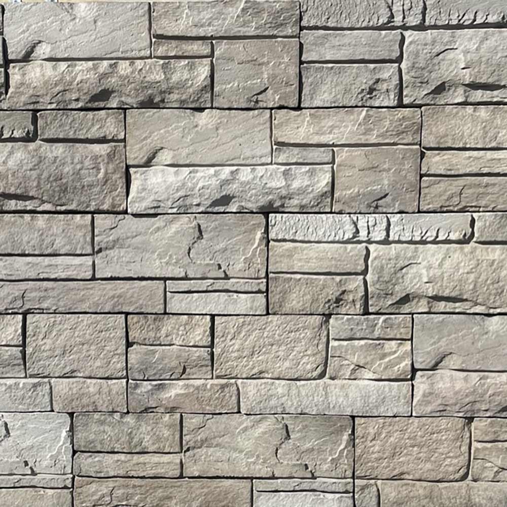 Gray stone brick interior panel with staggered rectangular block pattern