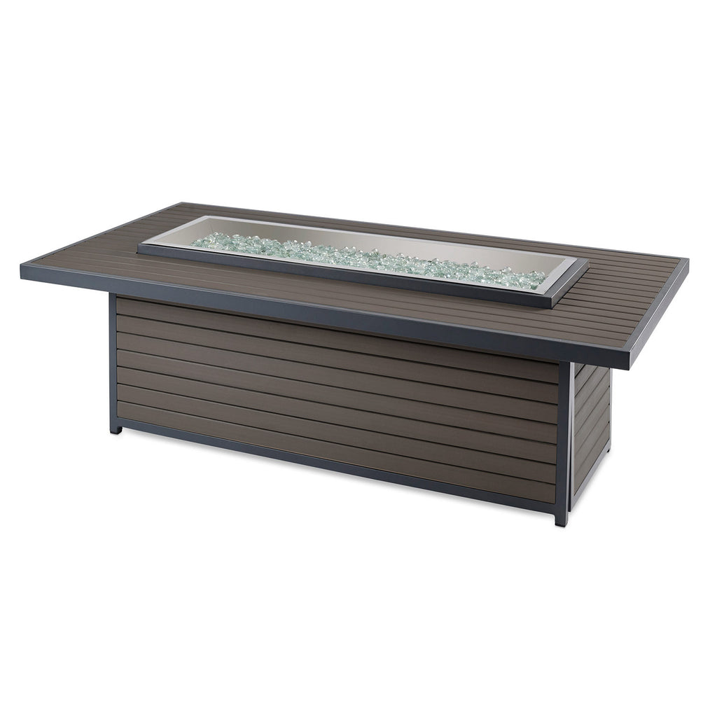 Gas fire pit table with glass insert and decorative burner stones, dark cabinet