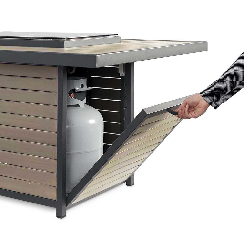 Gas fire pit table with open side panel showing propane tank storage and valve