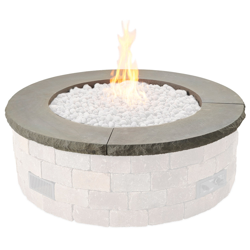 Round concrete fire pit with gray top and white brick base, flame in center