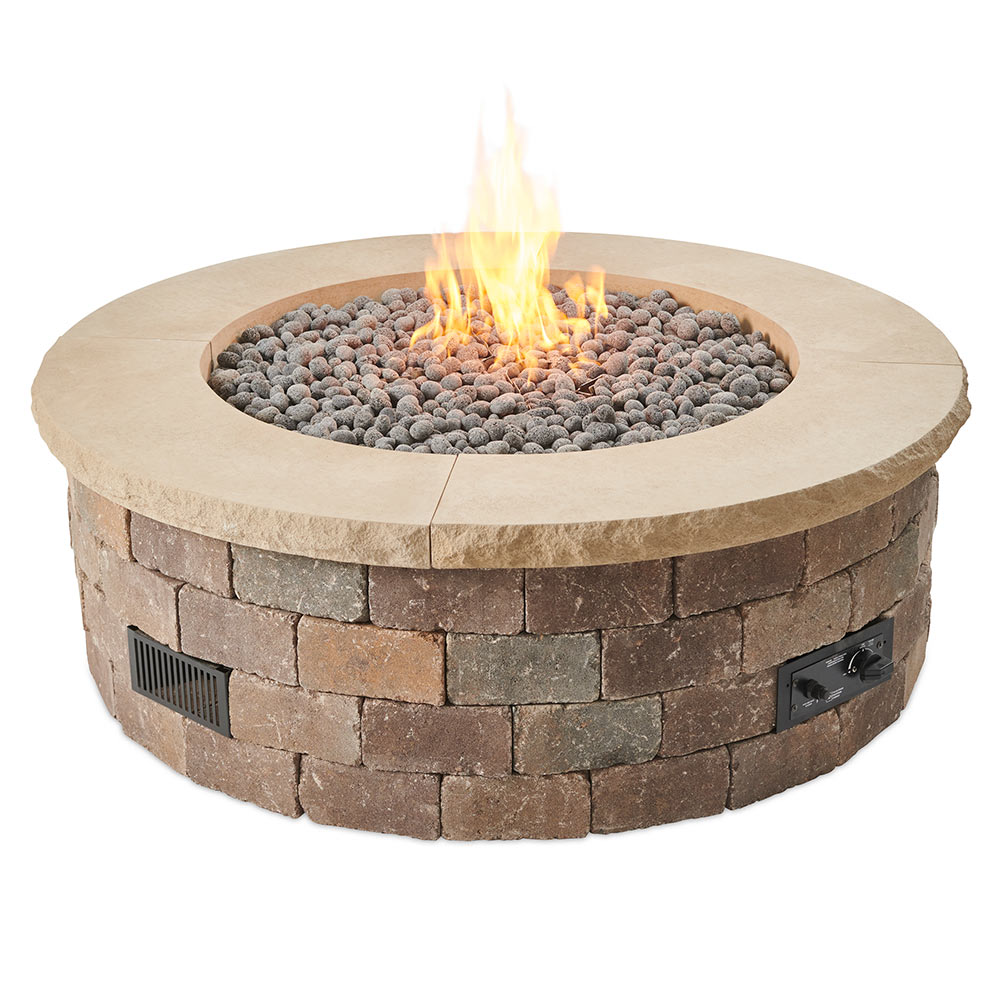 Round gas fire pit kit with stone block ring, flames, and lava rocks under beige top