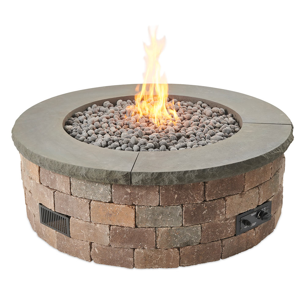 Round concrete fire pit with gray top and brown brick base, flame in center